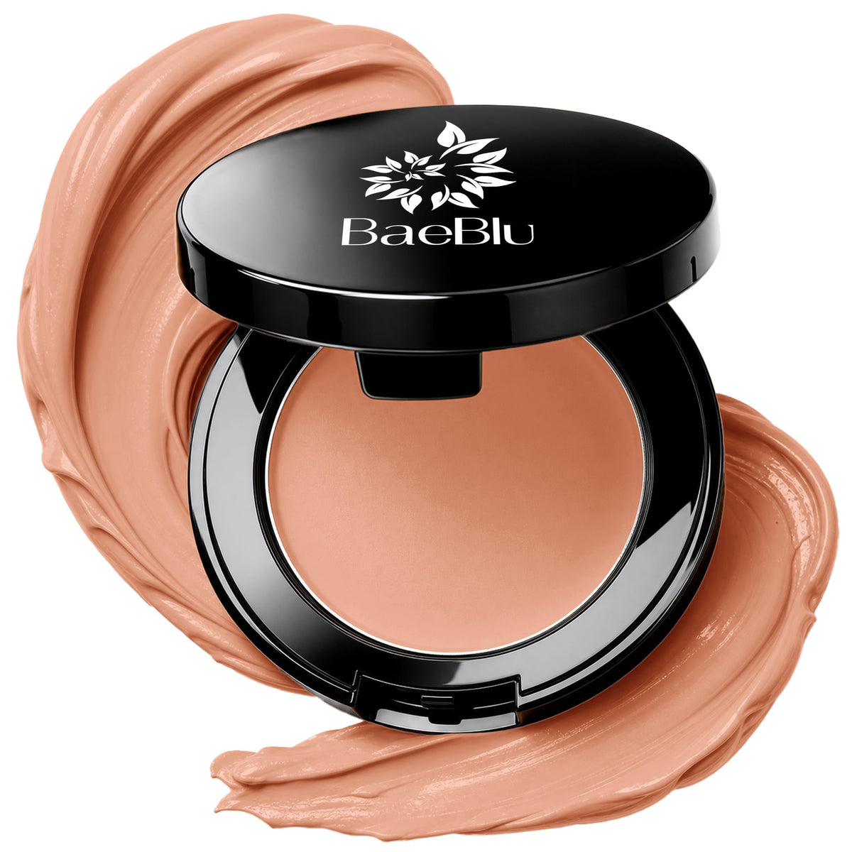 An open black BaeBlu concealer compact with a beige concealer inside, surrounded by decorative swirled makeup smears on a white background.